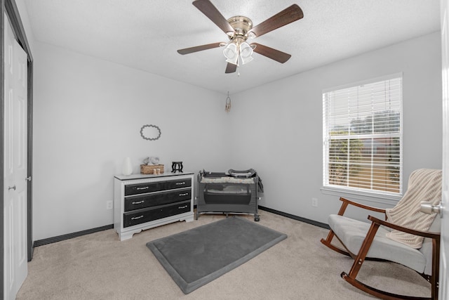 1775 Village Pkwy, Gulf Breeze, FL 32563 - sitting room featuring ceiling fan, light carpet, and a textured ceiling