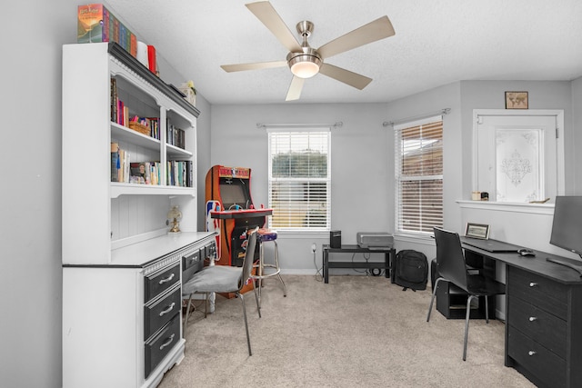 1775 Village Pkwy, Gulf Breeze, FL 32563 - home office with light carpet, a textured ceiling, built in desk, and ceiling fan