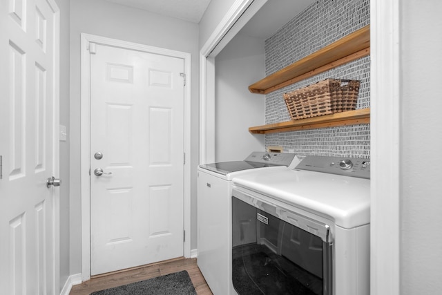 1775 Village Pkwy, Gulf Breeze, FL 32563 - laundry room with washer and clothes dryer and light hardwood / wood-style flooring