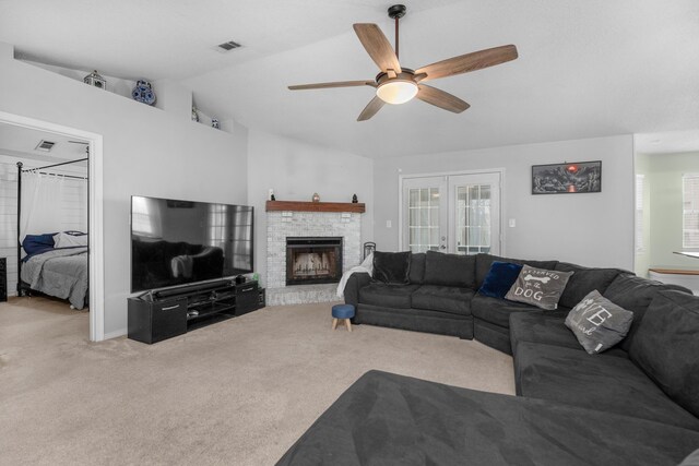 1775 Village Pkwy, Gulf Breeze, FL 32563 - living room with a fireplace, lofted ceiling, ceiling fan, light carpet, and french doors