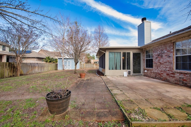 1775 Village Pkwy, Gulf Breeze, FL 32563 - view of yard with a patio and a storage shed