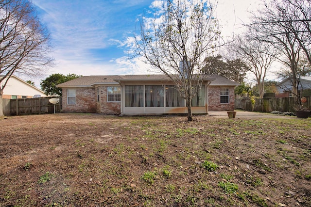 1775 Village Pkwy, Gulf Breeze, FL 32563 - back of house with a sunroom and a patio area