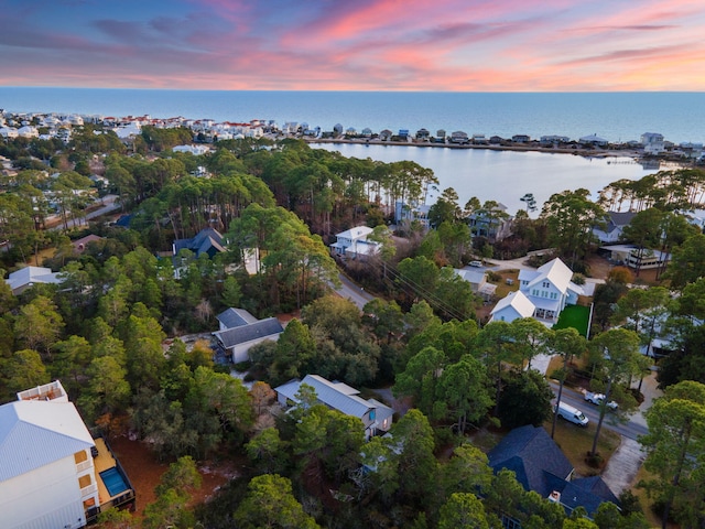 aerial view at dusk with a water view