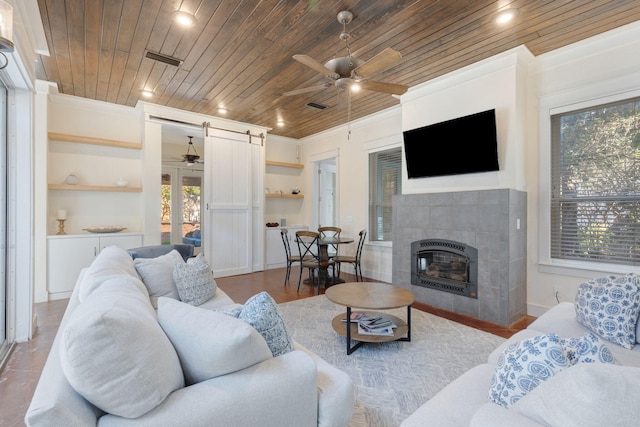 living room with crown molding, plenty of natural light, and wooden ceiling