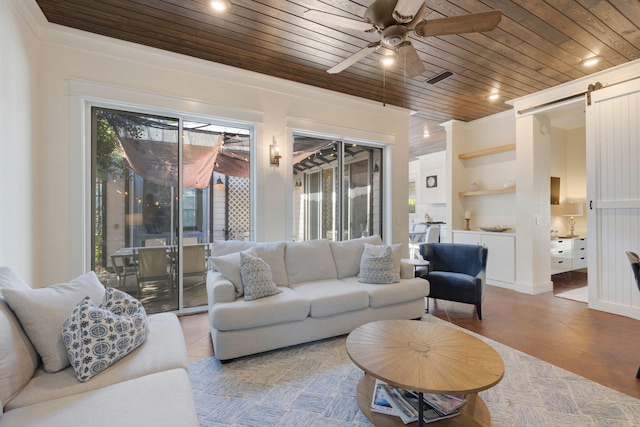 living room with a barn door, wooden ceiling, and ceiling fan