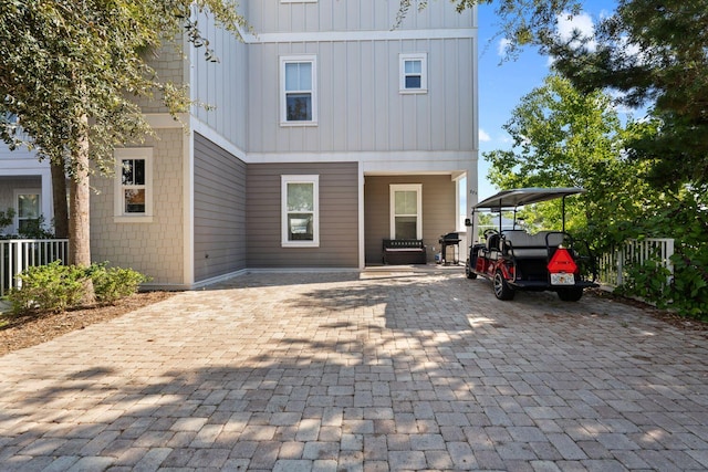 rear view of house with a carport