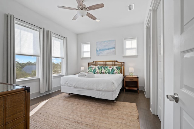 bedroom featuring dark hardwood / wood-style floors and ceiling fan