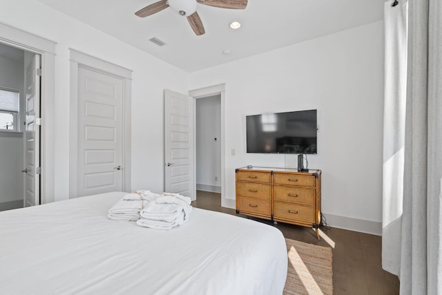 bedroom featuring ceiling fan and dark hardwood / wood-style flooring