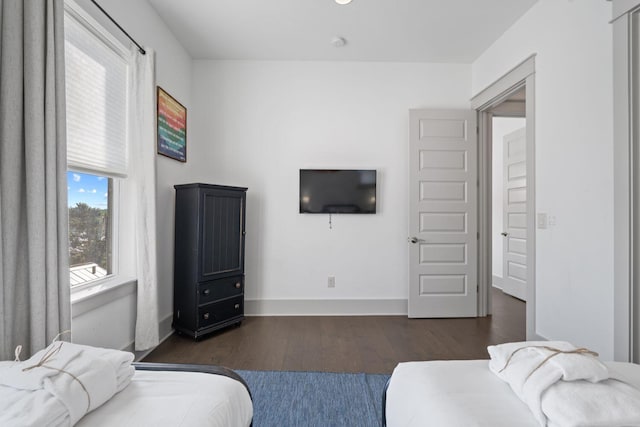 bedroom featuring dark hardwood / wood-style flooring