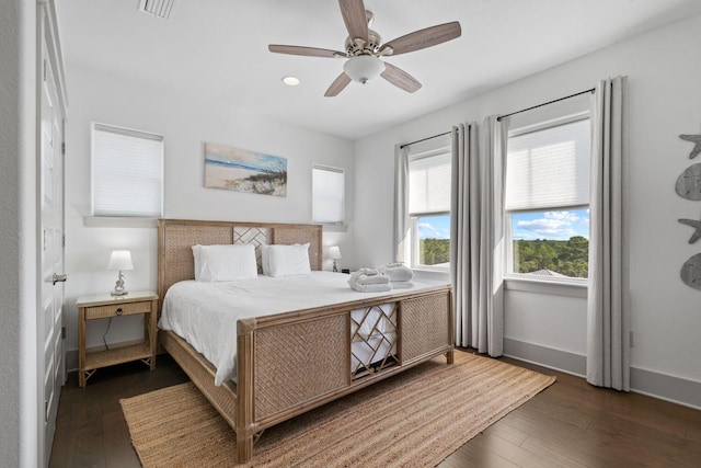 bedroom featuring dark wood-type flooring and ceiling fan