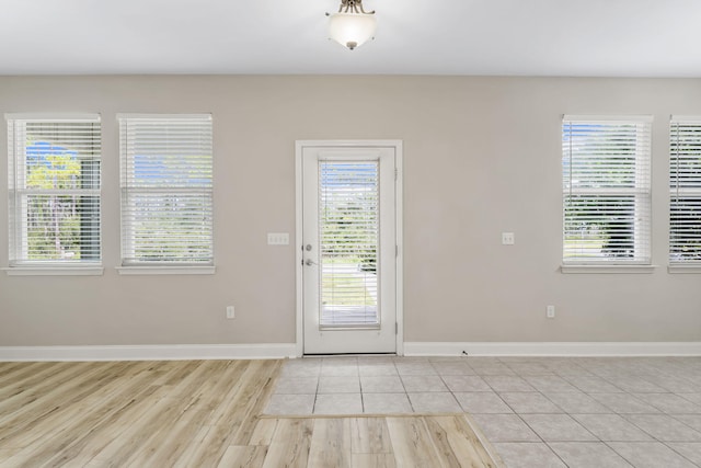 doorway featuring light tile patterned floors