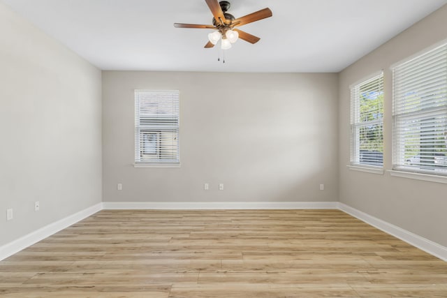 spare room featuring ceiling fan and light wood-type flooring