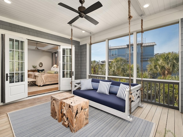 sunroom featuring wooden ceiling and ceiling fan