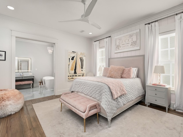 bedroom featuring hardwood / wood-style floors, ornamental molding, and ceiling fan