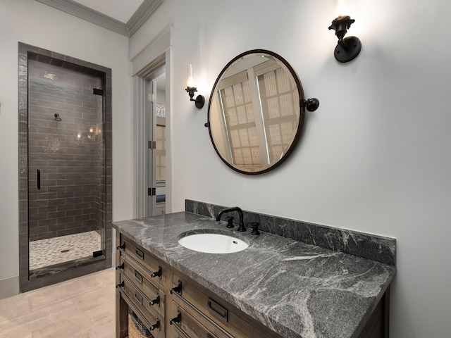 bathroom featuring crown molding, vanity, and a shower with shower door