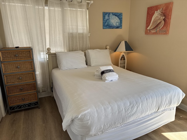 bedroom featuring dark wood-type flooring