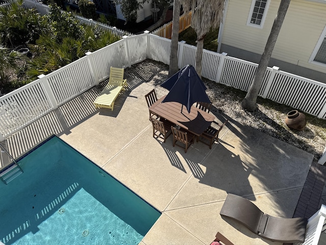 view of patio / terrace featuring a fenced in pool