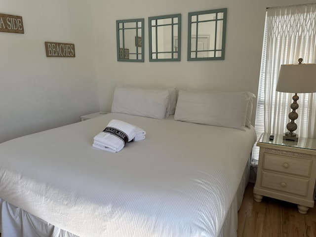 bedroom featuring wood-type flooring