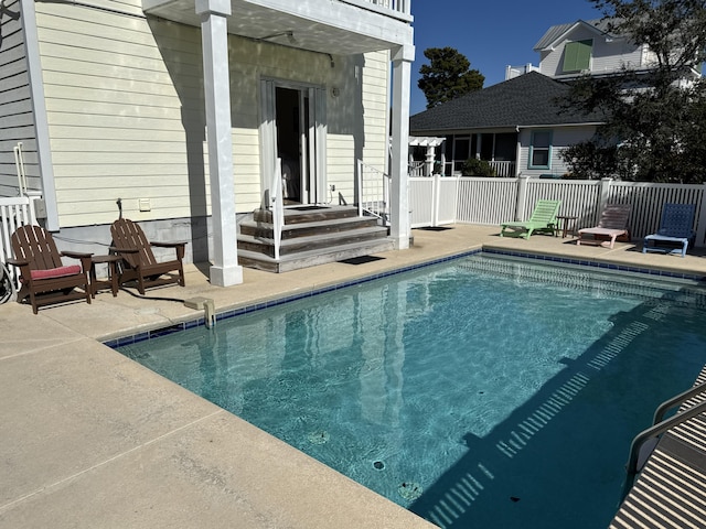 view of swimming pool featuring a patio