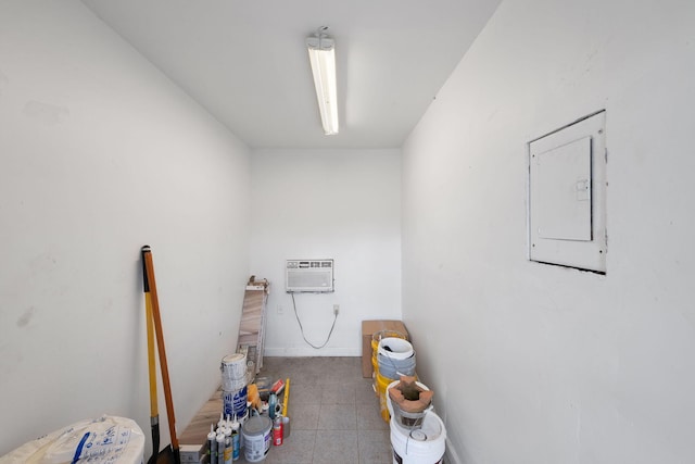 interior space featuring electric panel and a wall unit AC