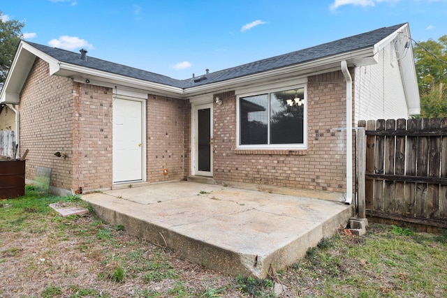 back of property with a patio