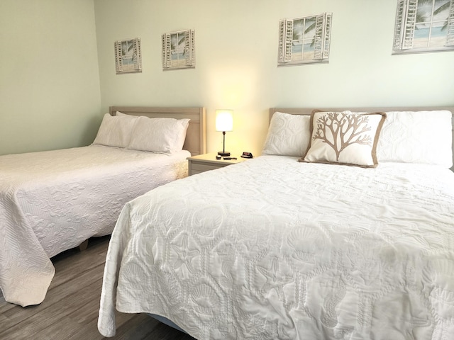 bedroom with wood finished floors