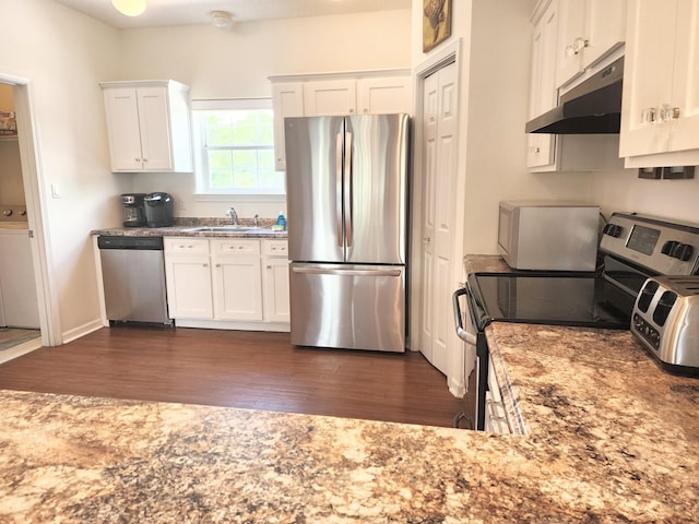 kitchen featuring a sink, stainless steel appliances, dark wood-type flooring, white cabinets, and under cabinet range hood