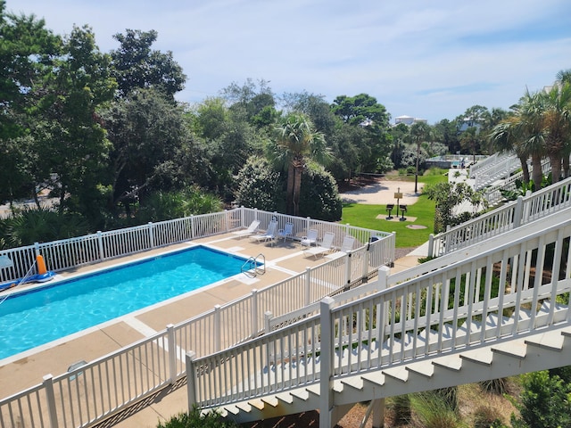 view of swimming pool with a patio area