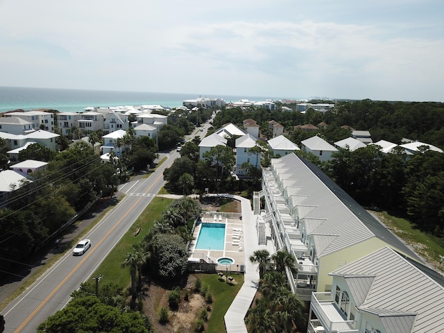 birds eye view of property with a water view and a residential view