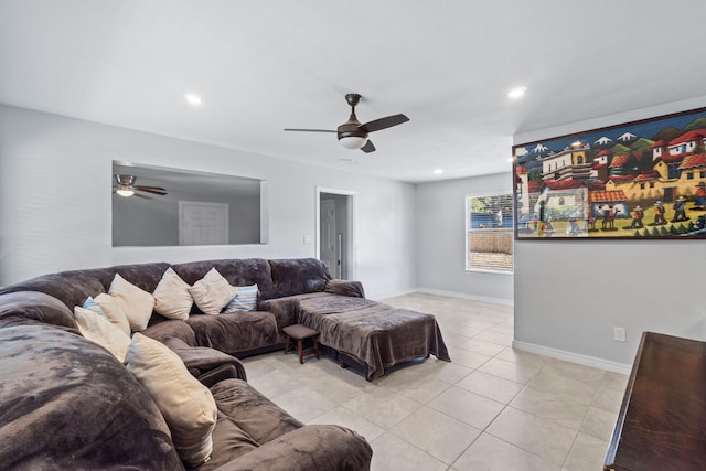 living room with ceiling fan and light tile patterned floors