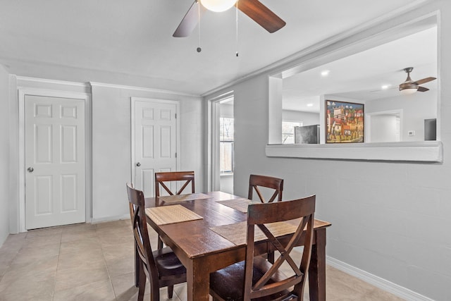 tiled dining room featuring ceiling fan