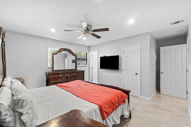 bedroom featuring ceiling fan and light tile patterned flooring