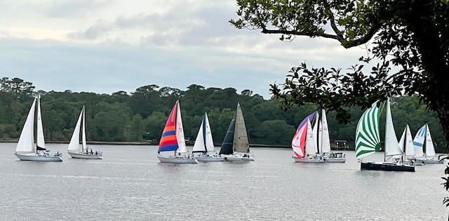 exterior space with a water view and a view of trees