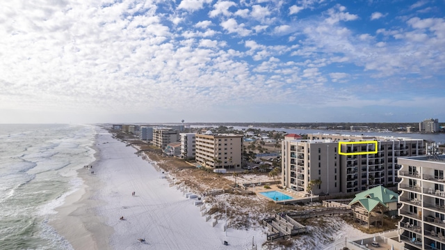 bird's eye view with a water view and a view of the beach