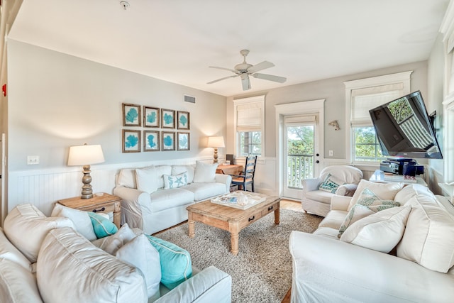 living room featuring hardwood / wood-style flooring and ceiling fan