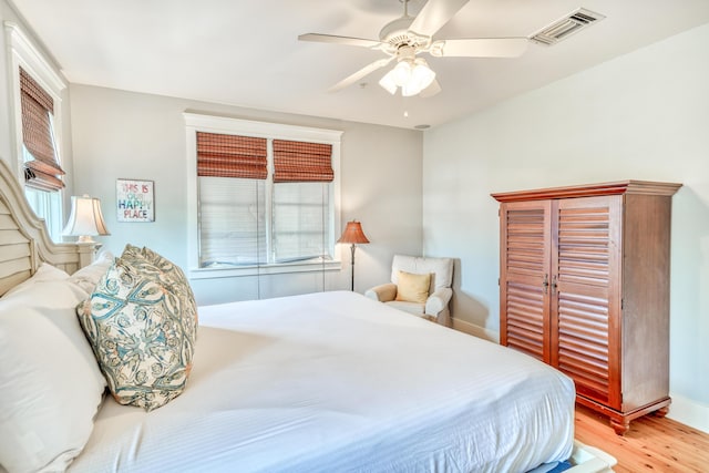 bedroom featuring light hardwood / wood-style flooring and ceiling fan