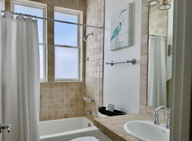 full bathroom with vanity, shower / bath combination with curtain, and toilet