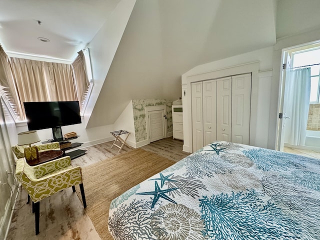 bedroom featuring light wood-type flooring and a closet