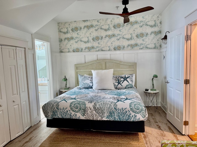 bedroom with lofted ceiling, ceiling fan, and light hardwood / wood-style flooring