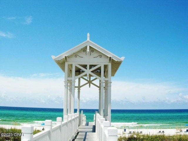 property view of water featuring a beach view