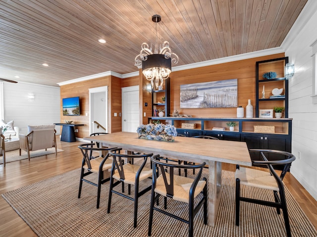 dining area featuring hardwood / wood-style flooring, ornamental molding, wooden ceiling, and an inviting chandelier