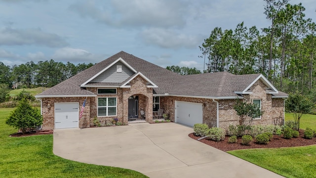 132 Gulf Pines Ct, Freeport, FL 32439 - craftsman house featuring driveway, a garage, brick siding, and a shingled roof