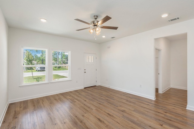 unfurnished room featuring wood-type flooring and ceiling fan