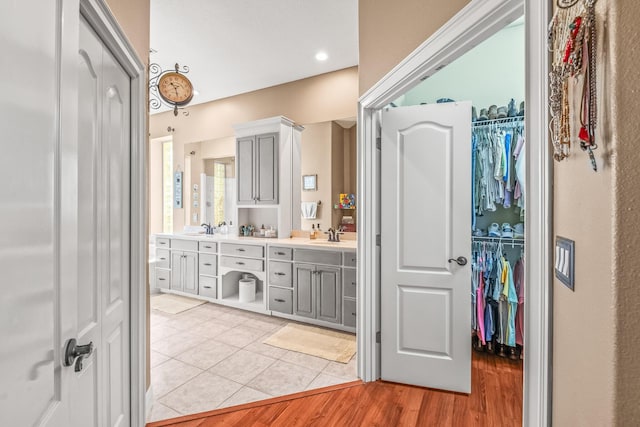 bathroom with vanity and hardwood / wood-style flooring