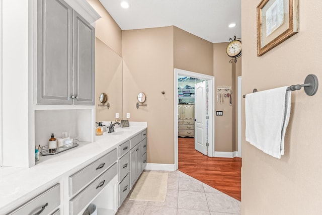 bathroom featuring tile patterned flooring and vanity