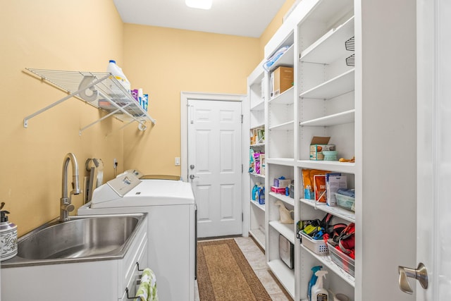 laundry area featuring sink and washer and dryer