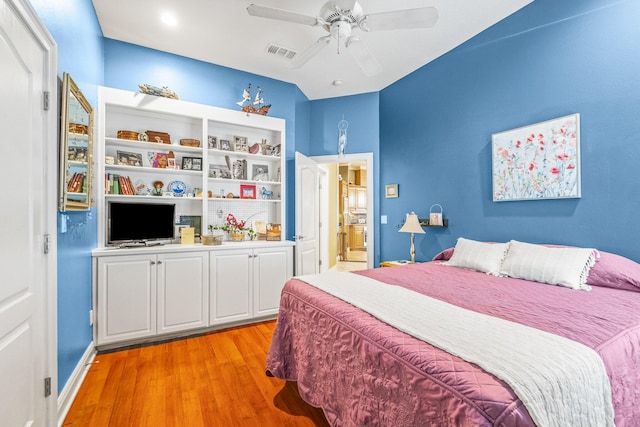 bedroom with ceiling fan and light hardwood / wood-style floors