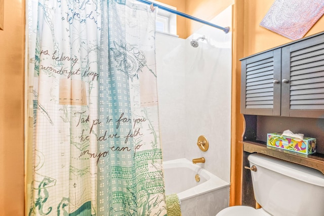 bathroom featuring toilet and shower / bath combo with shower curtain