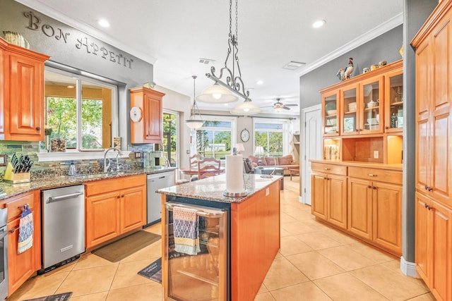 kitchen featuring a center island, stainless steel dishwasher, wine cooler, and light stone counters