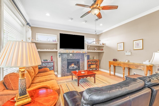 living room featuring crown molding, ceiling fan, and hardwood / wood-style flooring